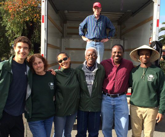 Christmas Project volunteers in front of the delivery truck